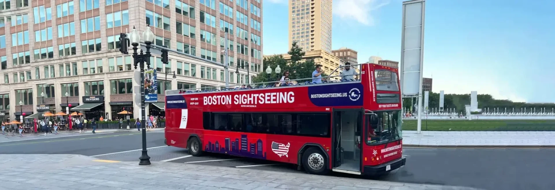 boston sightseeing red bus on road