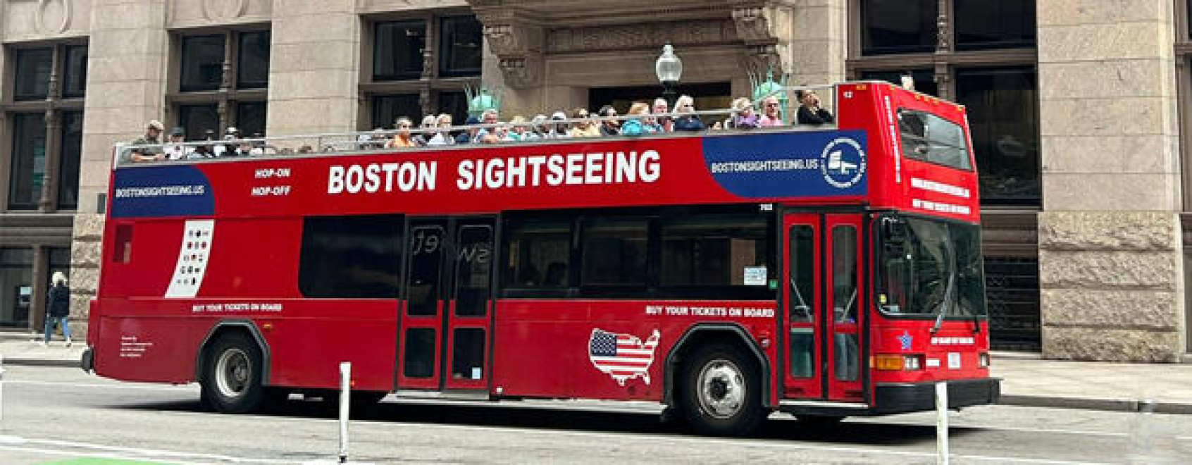 boston sightseeing red bus on road